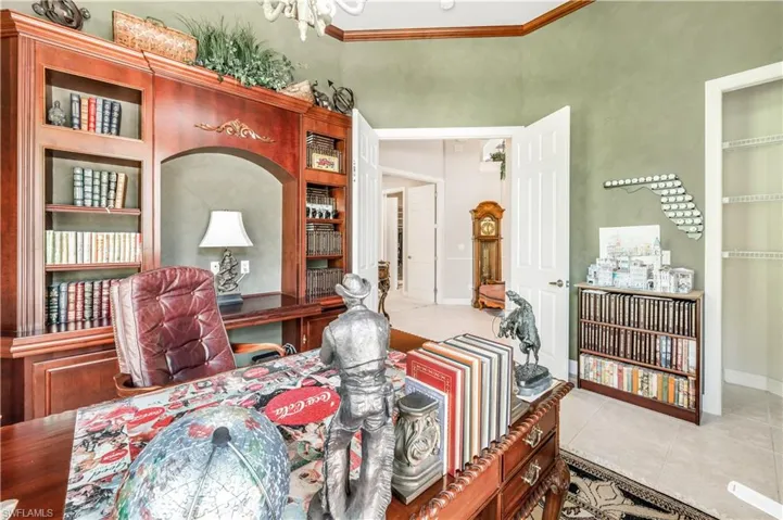 Tiled dining space with crown molding