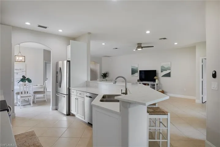 Spacious kitchen island with a single-basin sink and an extended countertop