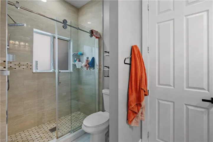 Bathroom with toilet and a shower stall