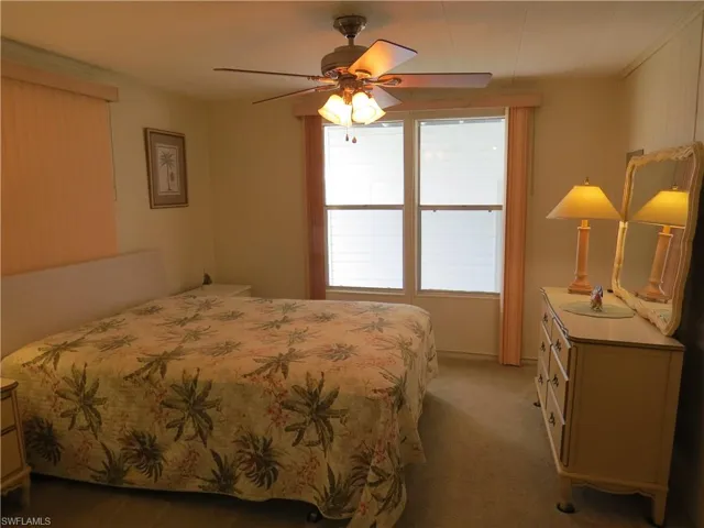 Bedroom featuring carpet flooring and a ceiling fan