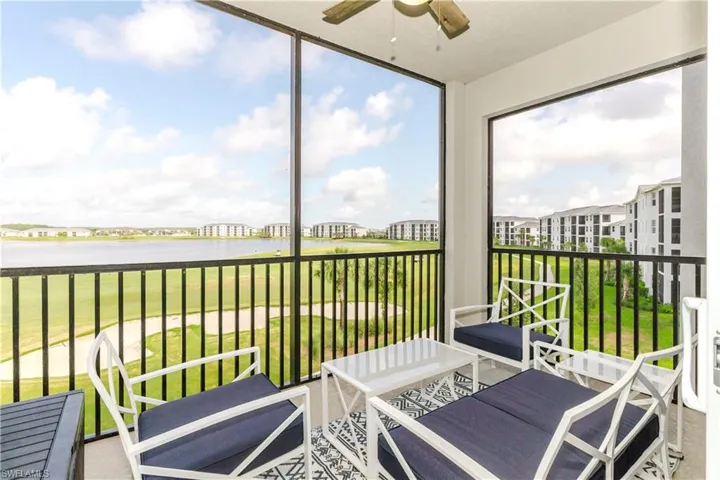 Sunroom featuring a water view