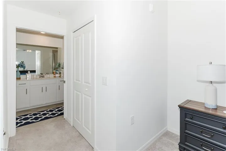 Corridor featuring baseboards