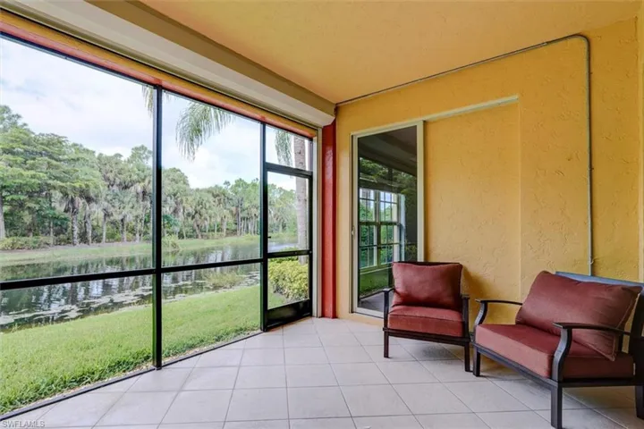 Sunroom with a water view