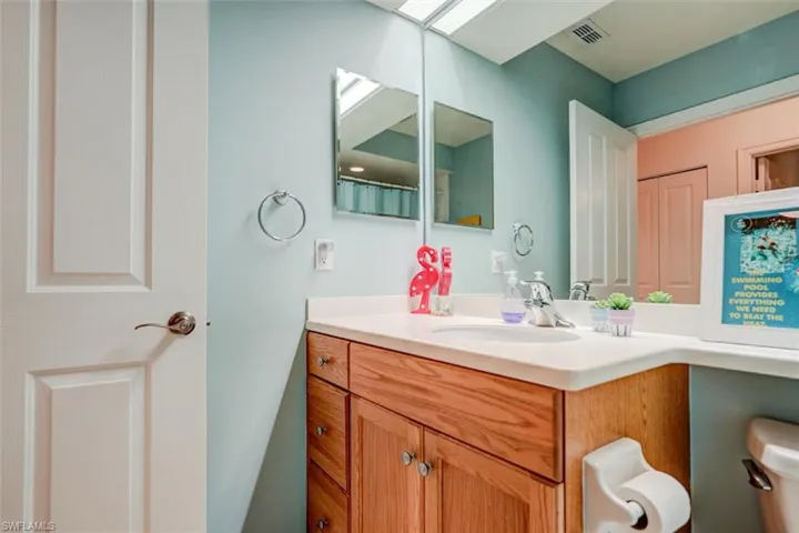 Bathroom featuring vanity and toilet
