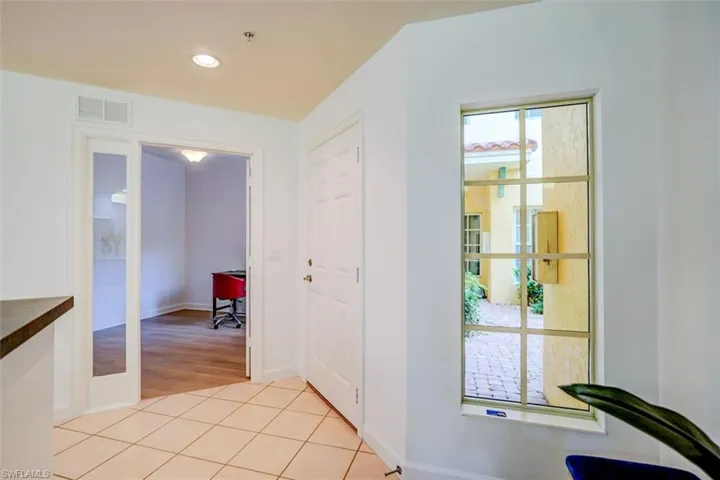 Corridor featuring light hardwood / wood-style flooring