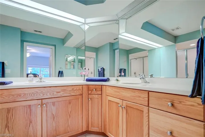 Bathroom with an enclosed shower and vanity