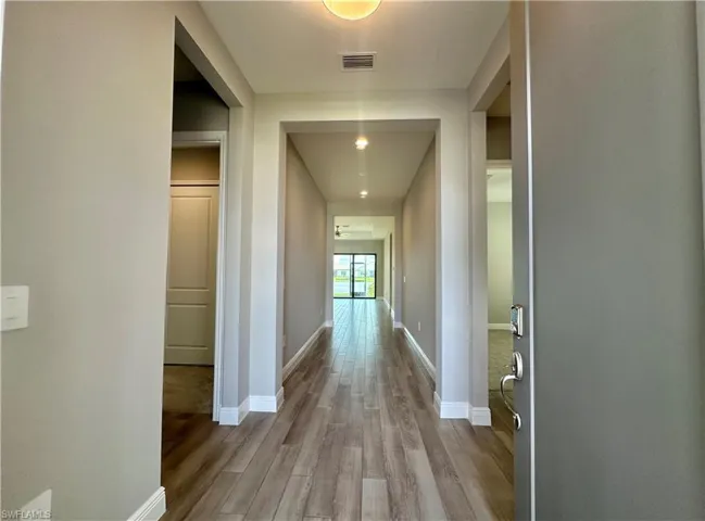 Corridor featuring light hardwood / wood-style flooring