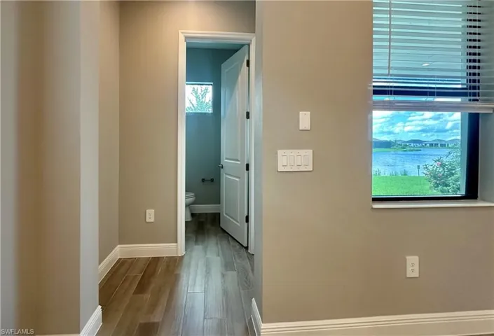 Hallway featuring light hardwood / wood-style flooring