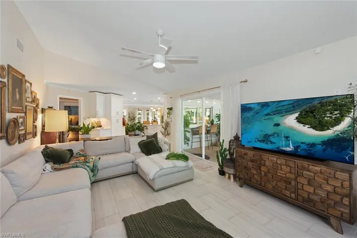Living room featuring a ceiling fan