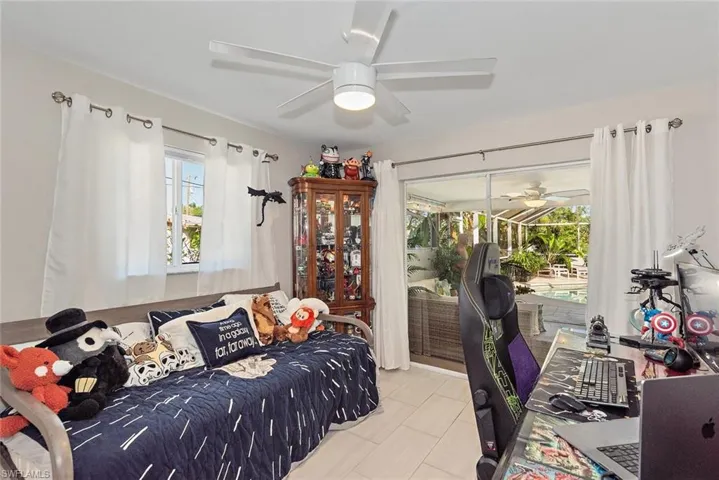 Bedroom with access to exterior and a sunroom