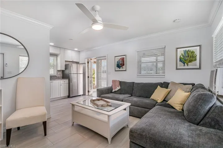 Open living with light-toned tile flooring!