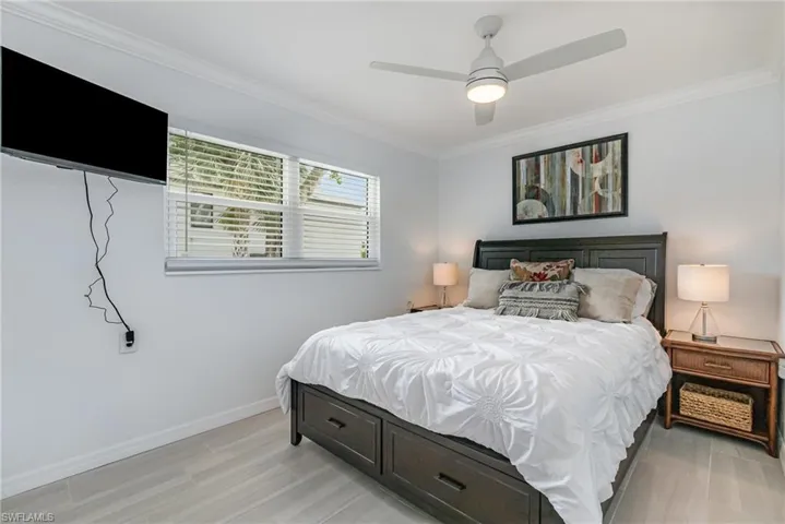 Master bedroom with wood-look tile flooring!