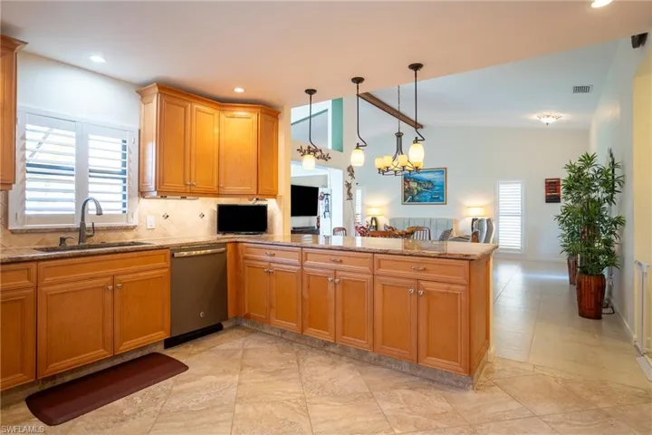 Large Kitchen featuring decorative backsplash & granite counter tops,