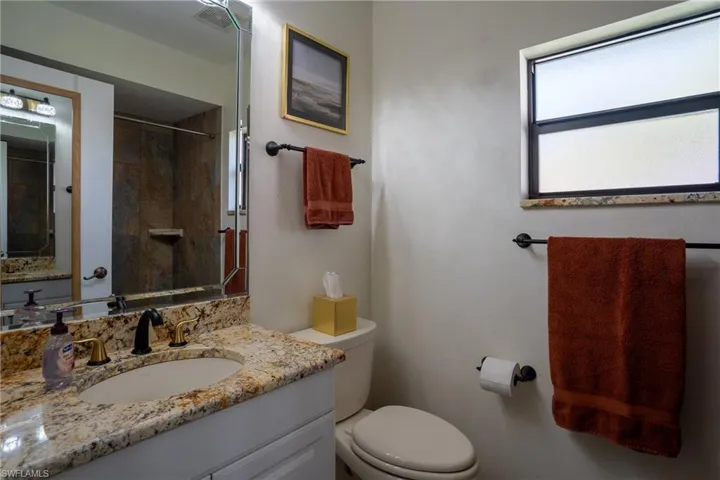 Primary Bathroom featuring a tile shower