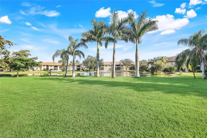 View of yard with a water view