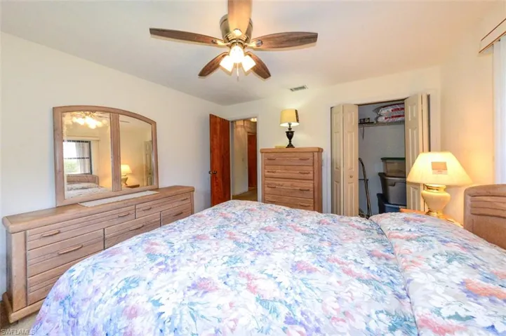 Bedroom 2 featuring ceiling fan and walk in closet