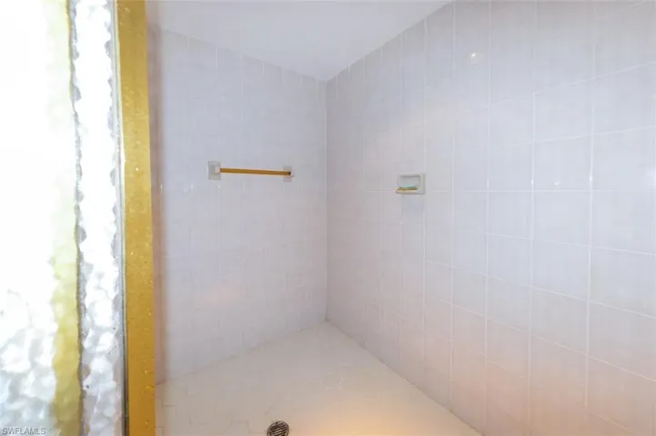 Bathroom with a tile shower