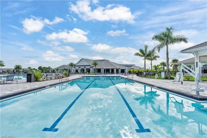 Community pool with a patio