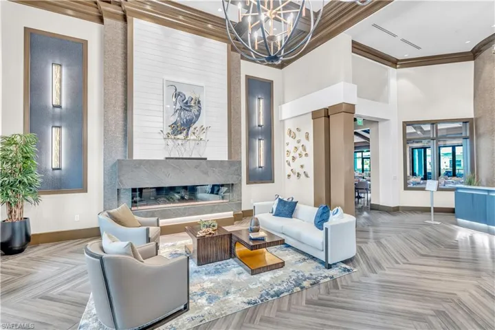 Common area featuring crown molding and a high ceiling
