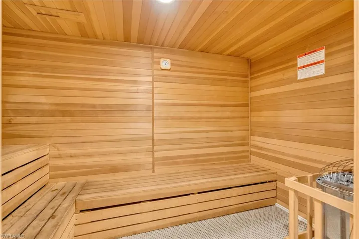 Relaxing sauna / steam room featuring wooden walls and wood ceiling