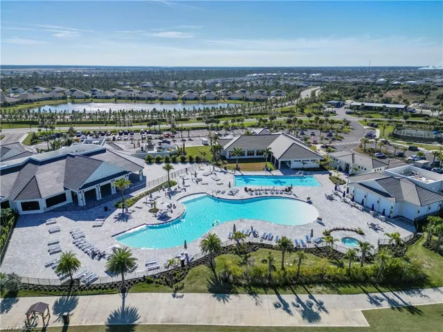 Aerial view of a pool and a large body of water