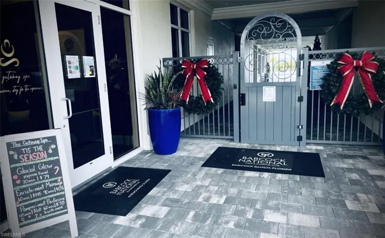 Entrance to property with a gate and covered porch