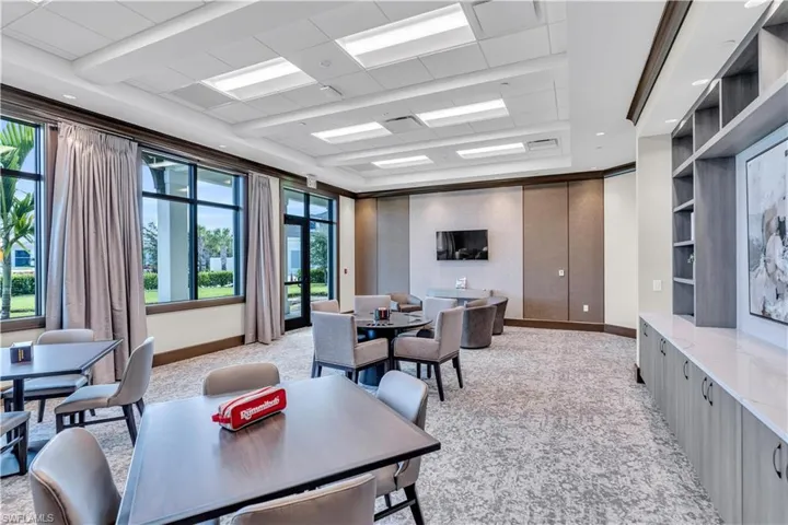 Home office with recessed lighting and a tray ceiling