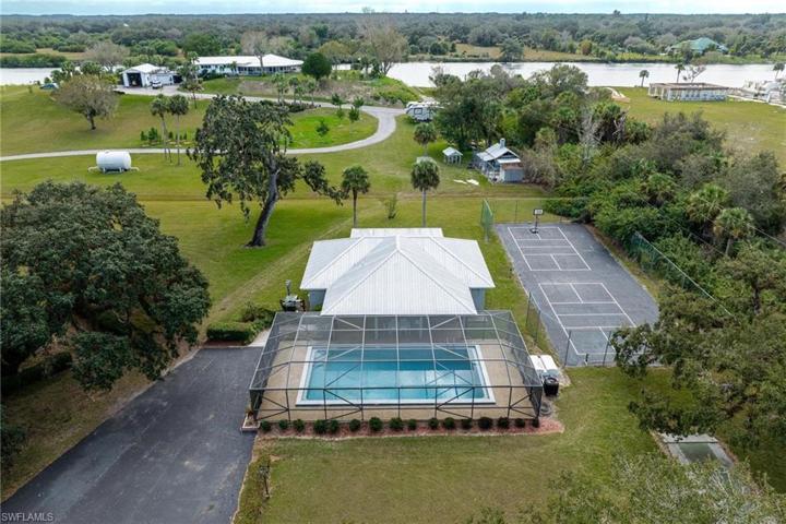 Community pool, clubhouse and tennis court.