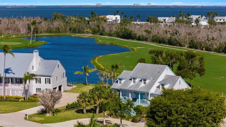 Drone / aerial view of a large body of water and a local golf course