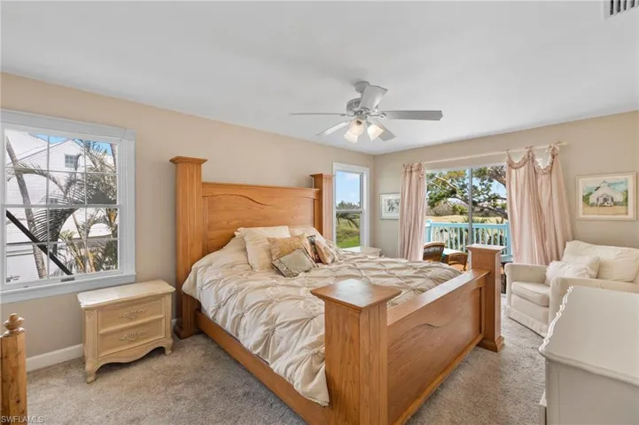 Bedroom featuring carpet, ceiling fan, and access to outside
