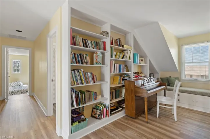 Living area featuring light wood finished floors and baseboards