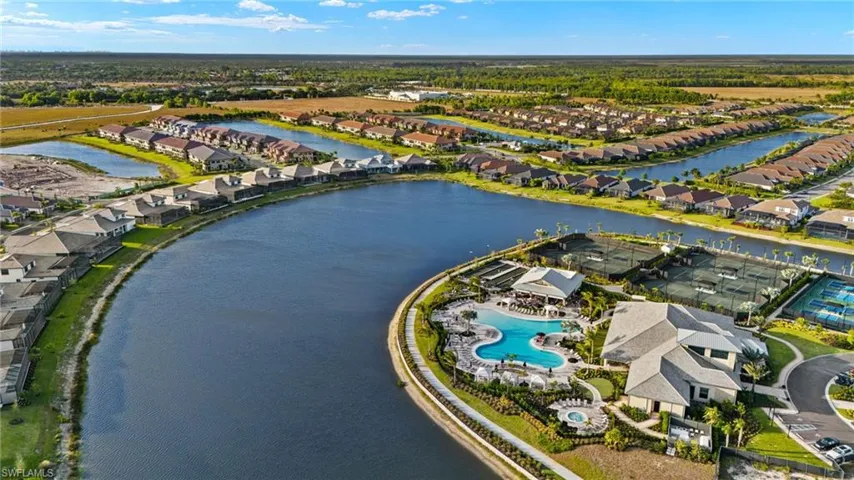 Aerial overview of property's location with nearby suburban area and a nearby body of water