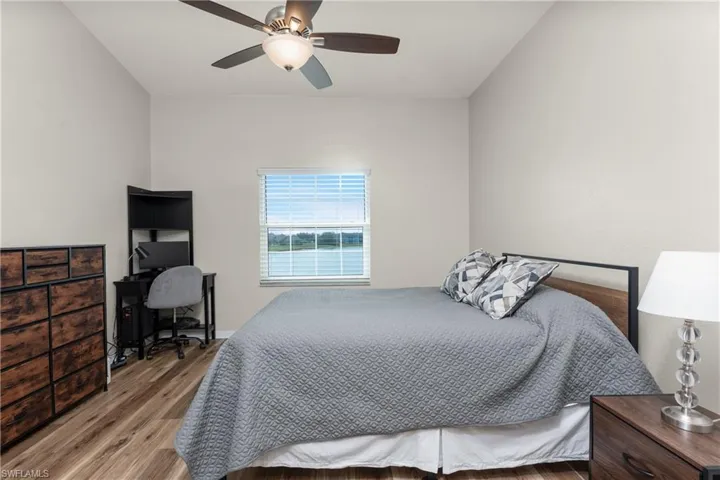 featuring wood-type flooring and ceiling fan