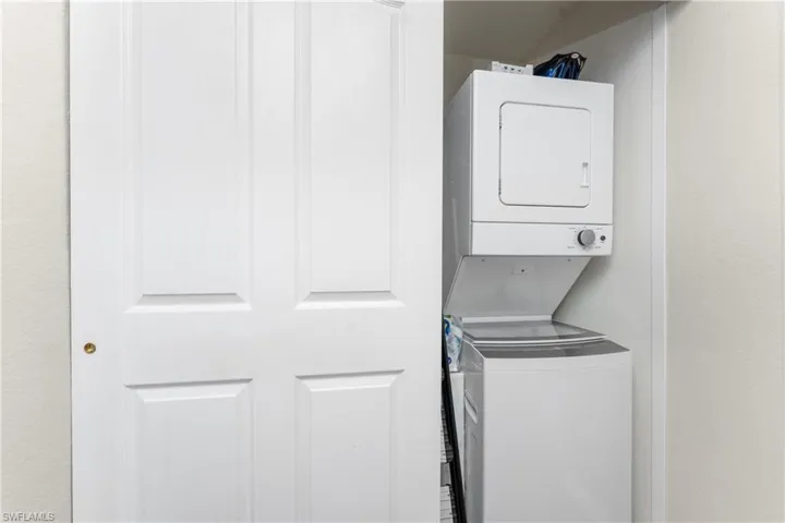 Laundry area featuring stacked washer and dryer