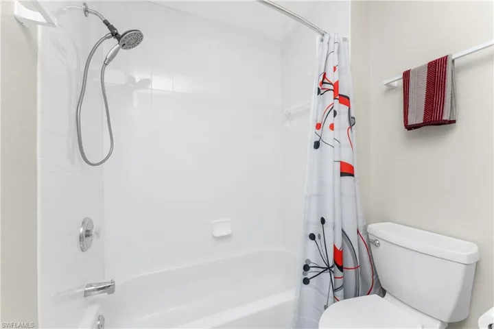 Bathroom with toilet and shower / tub combo
