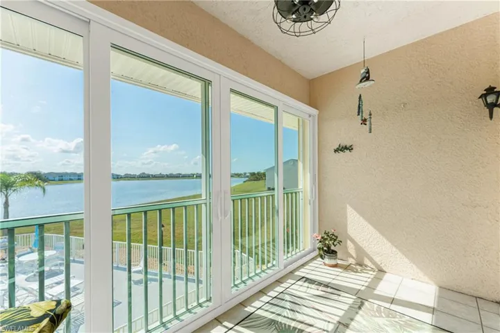 Unfurnished sunroom featuring a water view