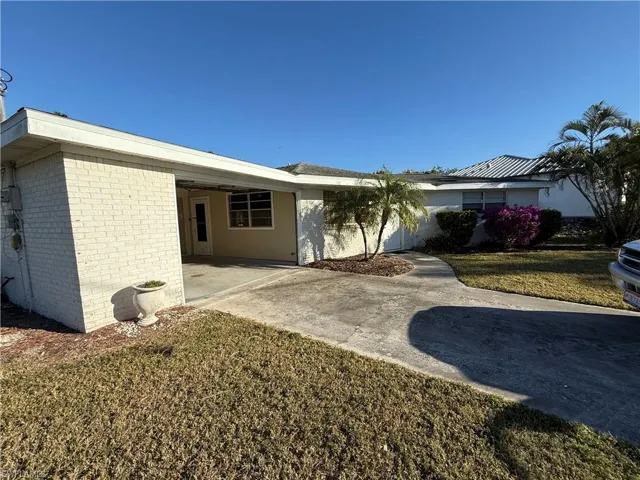 View of front of property with a front yard