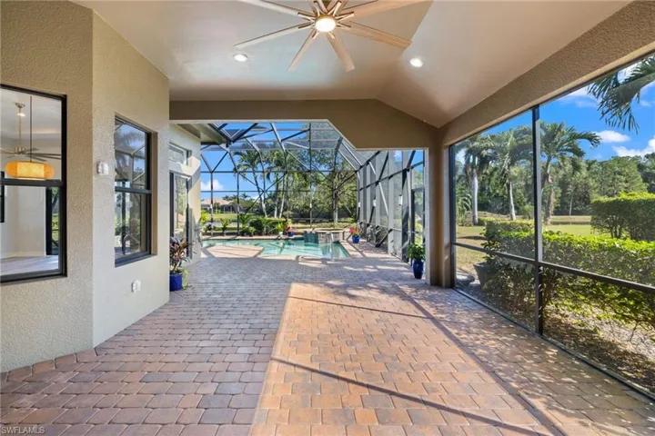 View of patio / terrace with glass enclosure and ceiling fan