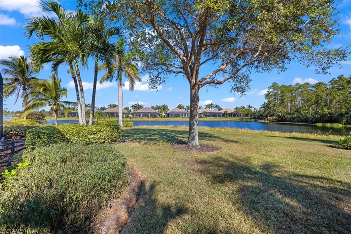 View of yard with a water view