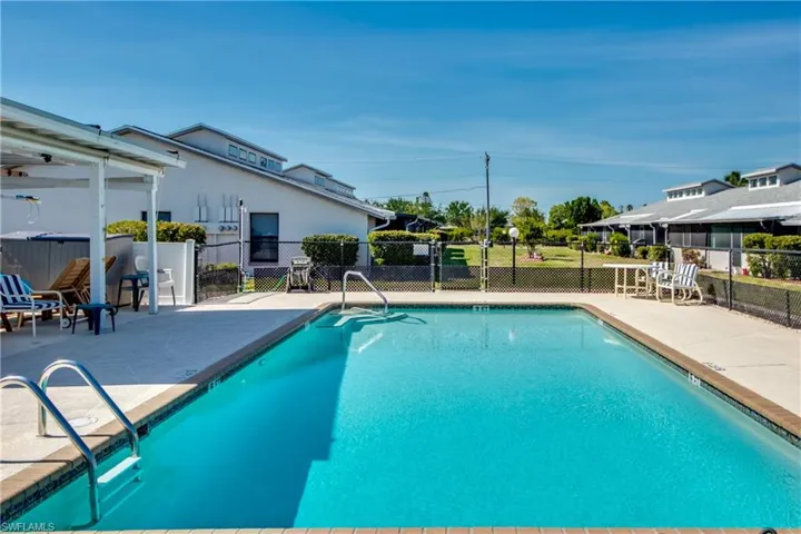 Community pool with a patio area