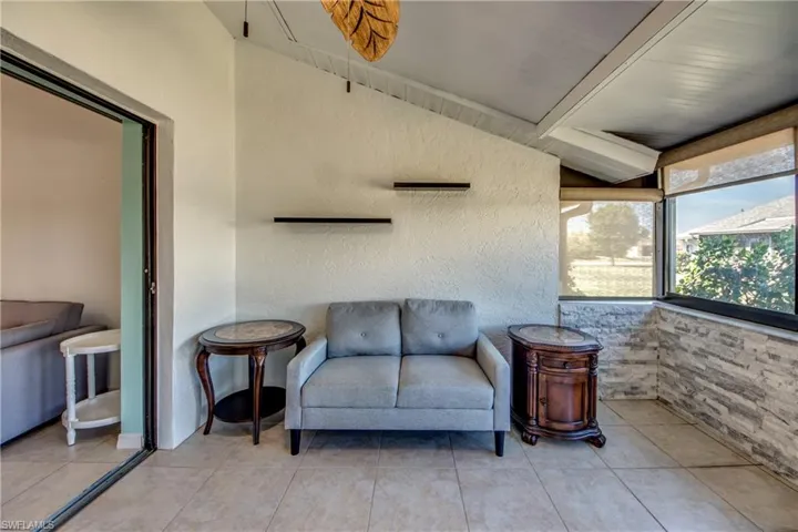 Sunroom with beam ceiling