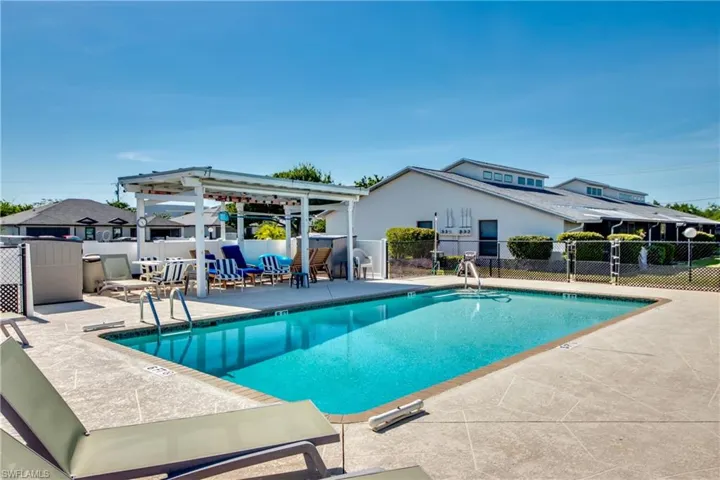 Community pool with a patio area