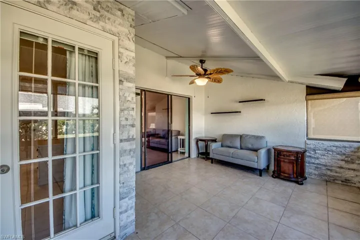 Sunroom with beamed ceiling
