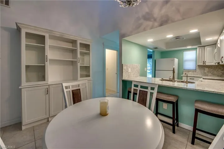 Dining room featuring baseboards and light tile patterned floors