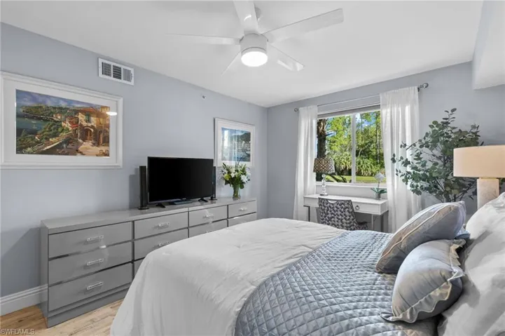 Bedroom with light wood-type flooring and ceiling fan