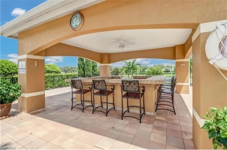 View of patio with a bar