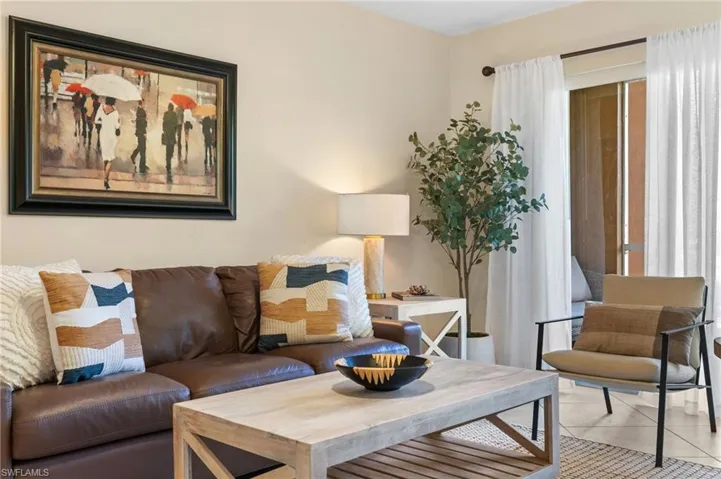 Living room featuring light tile patterned floors
