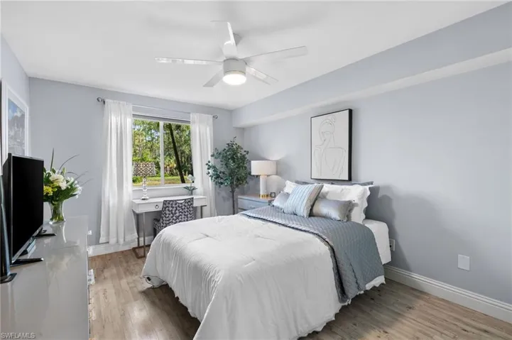 Bedroom with light wood-type flooring and ceiling fan