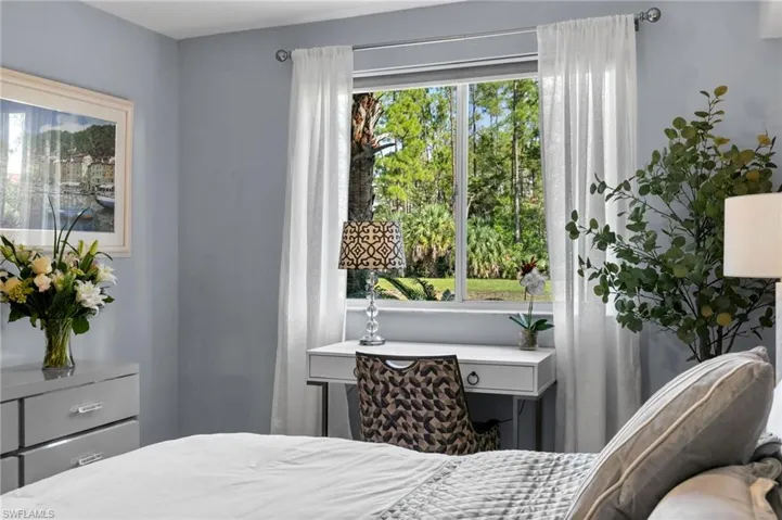 Bedroom with multiple windows