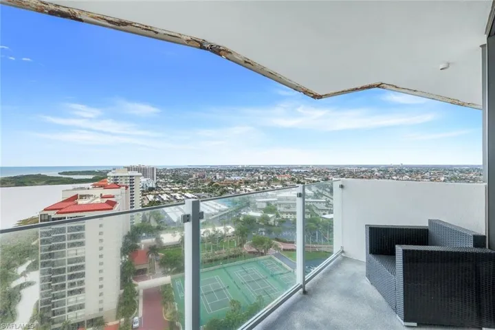 Balcony with a view of city and a water view